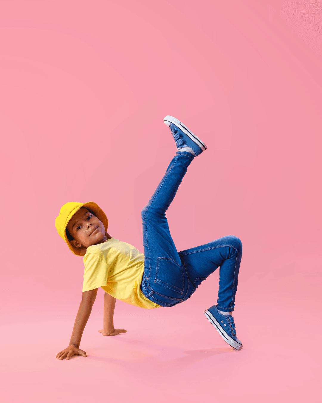 Happy child in a yellow hard hat
